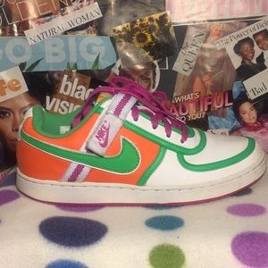 White and orange Nike sneakers with pink and green